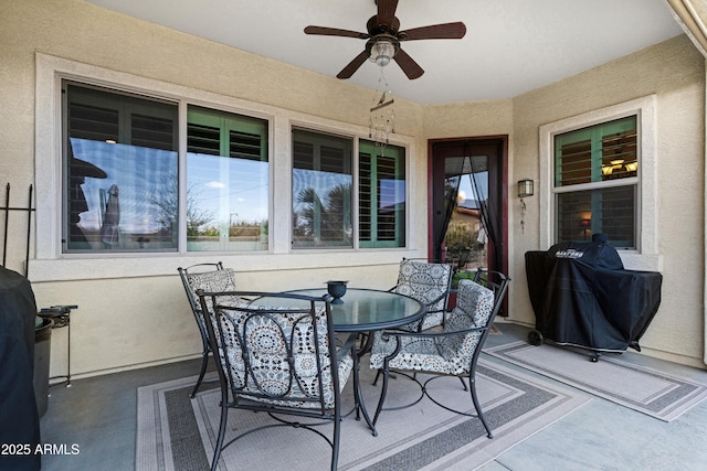 view of patio / terrace with outdoor dining space and a ceiling fan