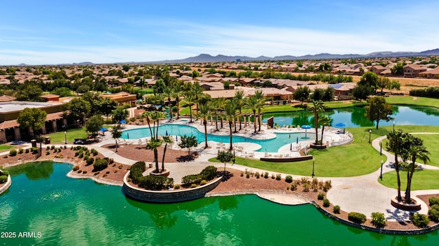 aerial view featuring a water and mountain view and a residential view