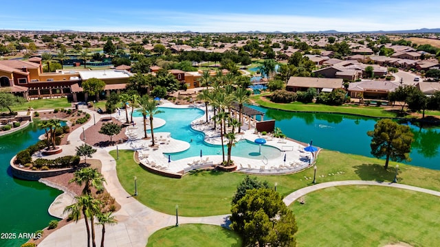 aerial view featuring a water view and a residential view