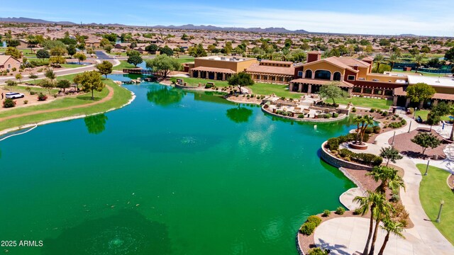 birds eye view of property with a residential view and a water and mountain view