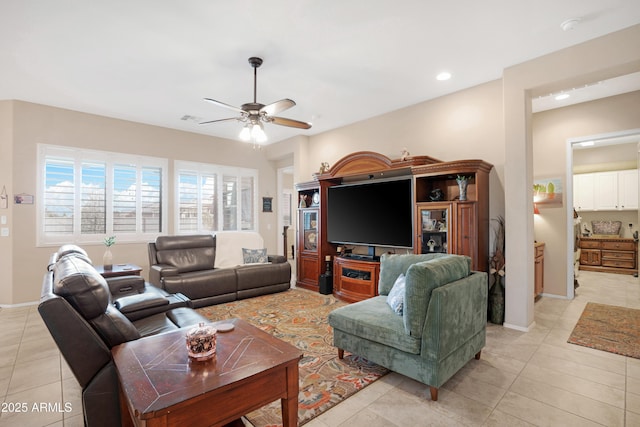 living area with light tile patterned floors, visible vents, baseboards, a ceiling fan, and recessed lighting