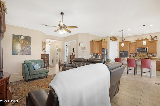 living room with recessed lighting, visible vents, ceiling fan, and light tile patterned floors