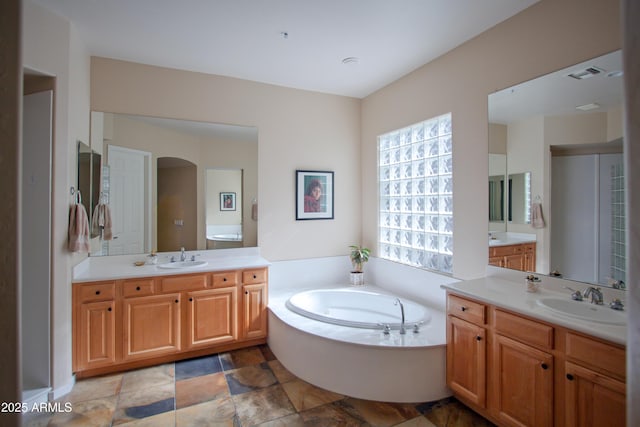 14045 E Geronimo Rd, Scottsdale, AZ 85259 - bathroom featuring a sink, visible vents, a garden tub, and two vanities