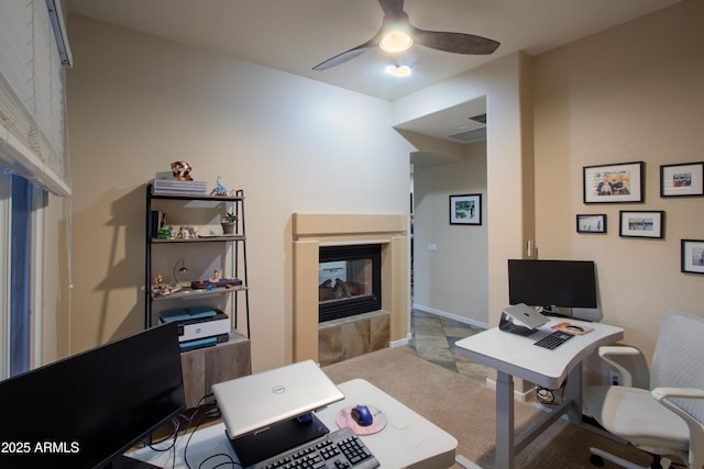 14045 E Geronimo Rd, Scottsdale, AZ 85259 - office space with a multi sided fireplace, a ceiling fan, and carpet flooring
