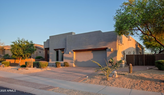 14045 E Geronimo Rd, Scottsdale, AZ 85259 - view of front of home with concrete driveway, stucco siding, fence, and a garage