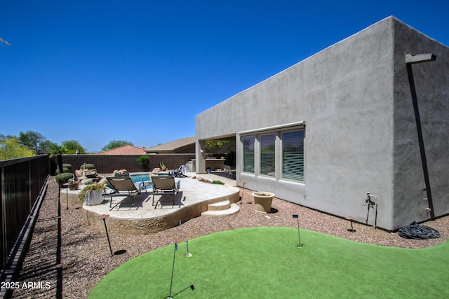 14045 E Geronimo Rd, Scottsdale, AZ 85259 - back of house with a fenced backyard, a patio area, and stucco siding
