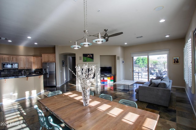 14045 E Geronimo Rd, Scottsdale, AZ 85259 - dining area featuring ceiling fan, visible vents, arched walkways, baseboards, and recessed lighting