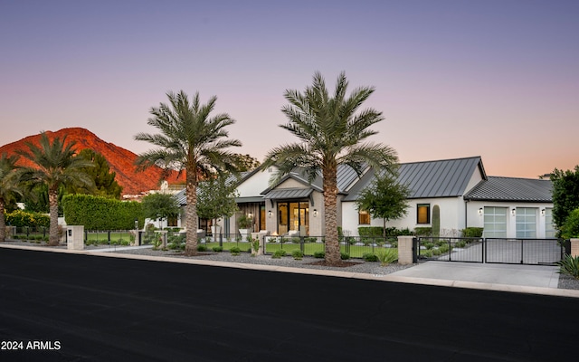 view of front of house featuring a garage and a mountain view