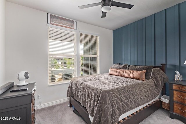 bedroom featuring carpet, baseboards, and a ceiling fan