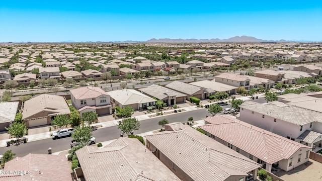 aerial perspective of suburban area featuring a mountain backdrop