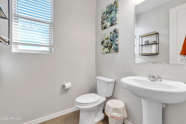 bathroom featuring tile patterned flooring, sink, and toilet