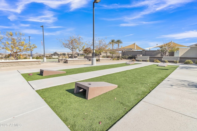 view of home's community with a lawn