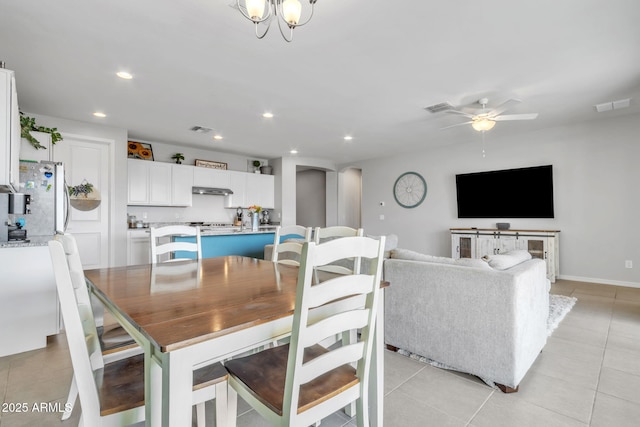 dining area featuring ceiling fan and light tile patterned floors