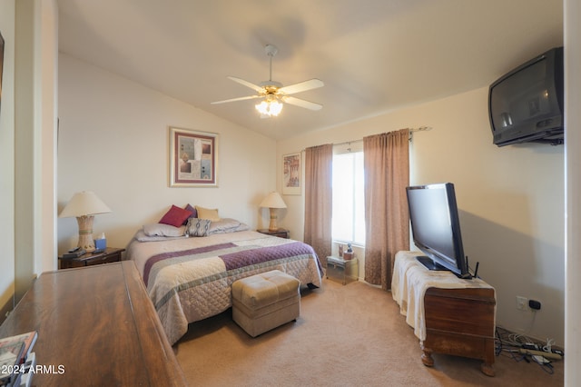 carpeted bedroom with vaulted ceiling and ceiling fan