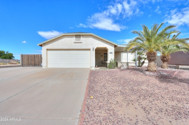 single story home with a garage