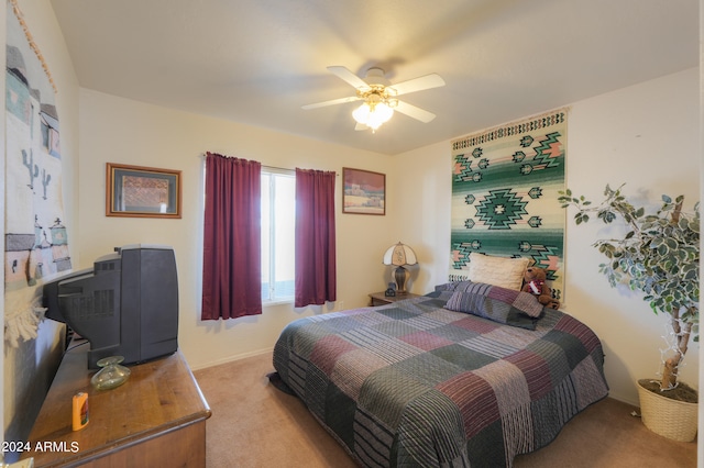 bedroom with light carpet and ceiling fan