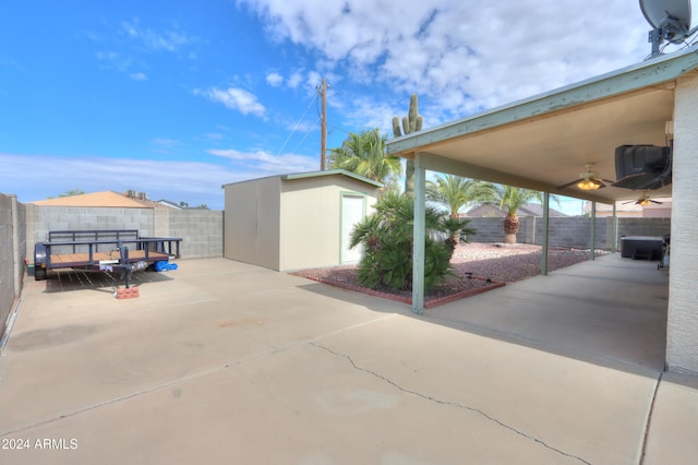 view of patio / terrace featuring a shed and ceiling fan