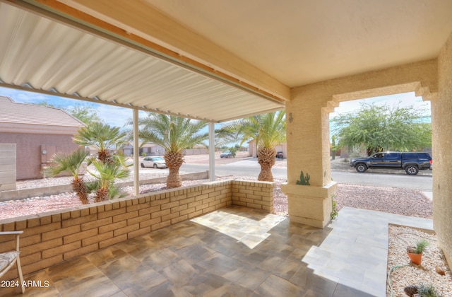 view of patio / terrace with a carport