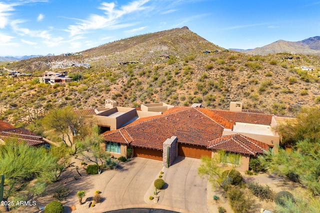 birds eye view of property featuring a mountain view