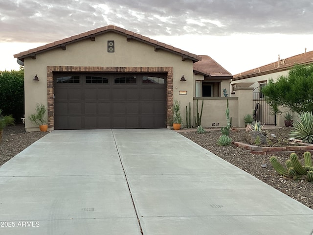 mediterranean / spanish-style home featuring a garage