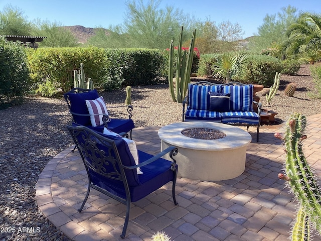 view of patio / terrace with an outdoor fire pit