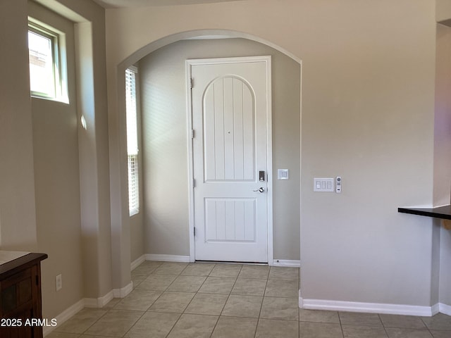 foyer featuring light tile patterned floors