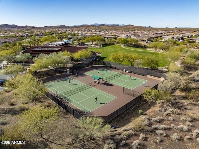 birds eye view of property with a mountain view