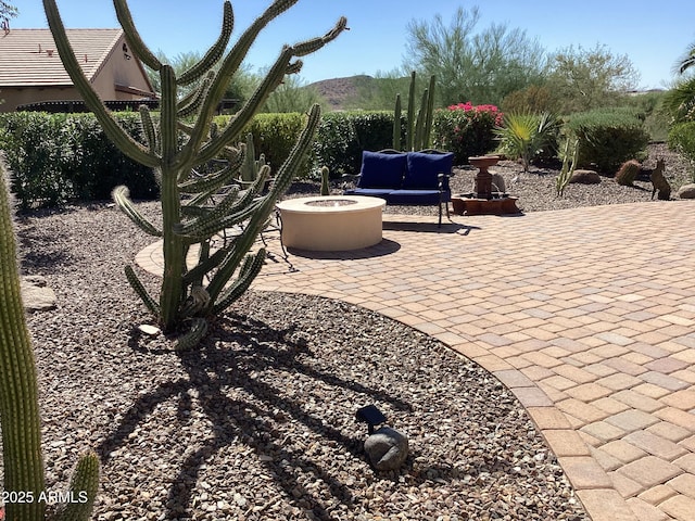 view of patio / terrace with an outdoor fire pit