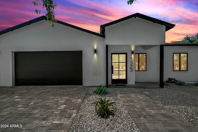 view of front of property with a garage