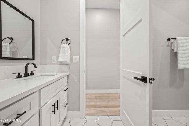 bathroom featuring tile flooring and oversized vanity