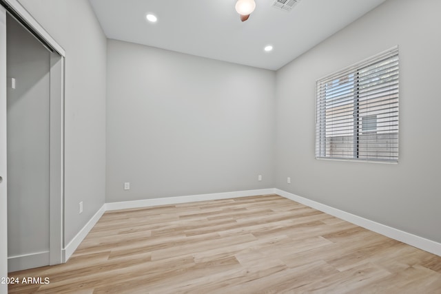 unfurnished room featuring light wood-type flooring