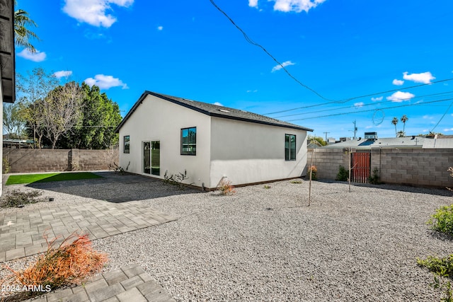 back of property with a patio area