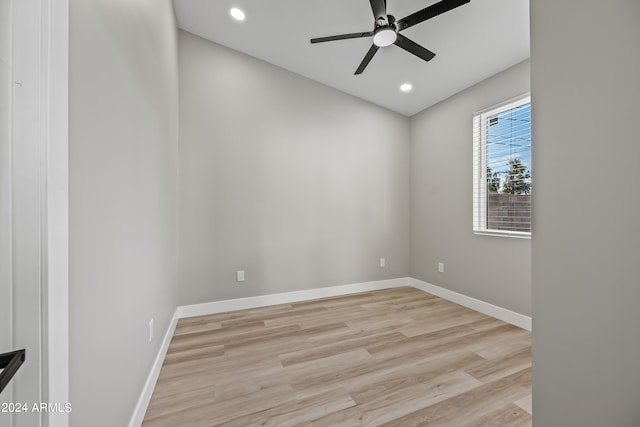 unfurnished room with ceiling fan and light wood-type flooring