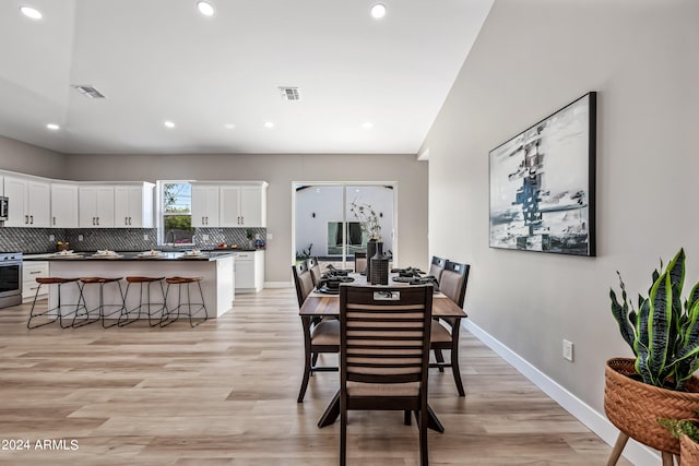 dining area with light wood-type flooring