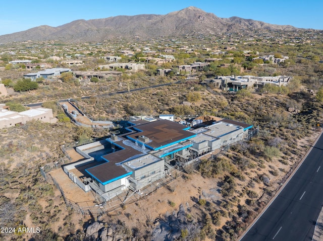 birds eye view of property with a mountain view