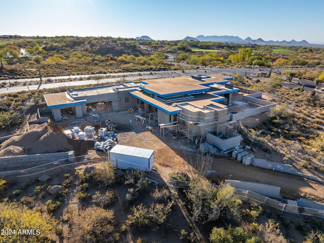 birds eye view of property featuring a mountain view