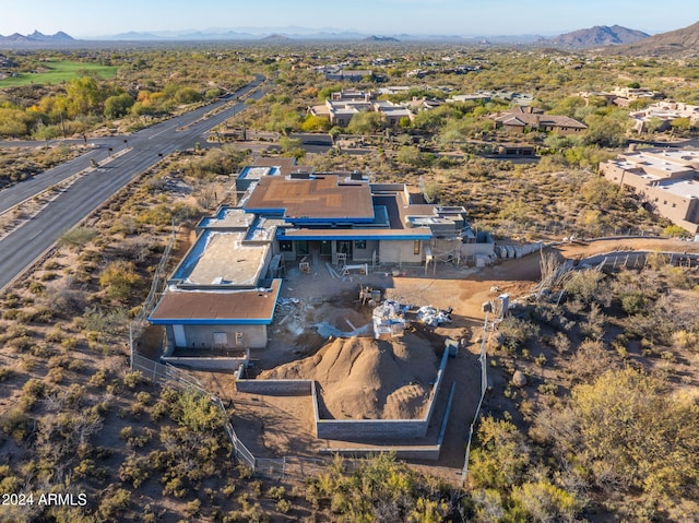 birds eye view of property with a mountain view