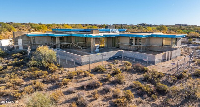 view of community with a patio area and an outdoor living space with a fire pit