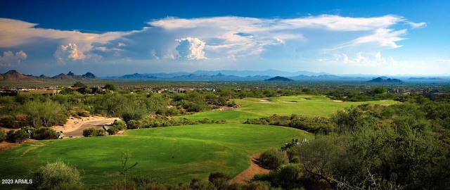 exterior space with a mountain view and view of golf course