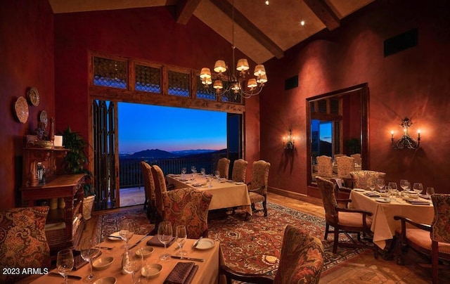 dining area featuring beamed ceiling, a notable chandelier, and high vaulted ceiling