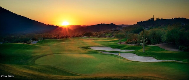 view of property's community featuring a mountain view and view of golf course