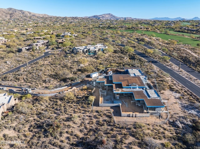 birds eye view of property with a mountain view