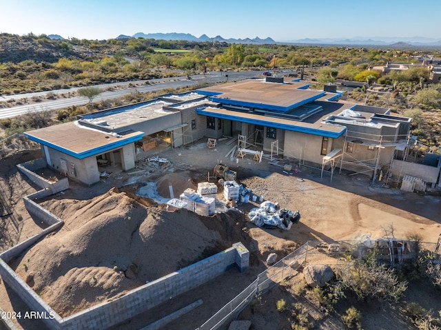 birds eye view of property with a mountain view