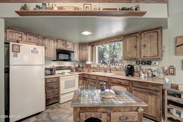 kitchen with sink, white appliances, and tile floors