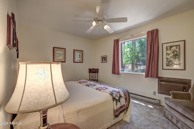 bedroom with a baseboard heating unit, a wall unit AC, carpet floors, and ceiling fan