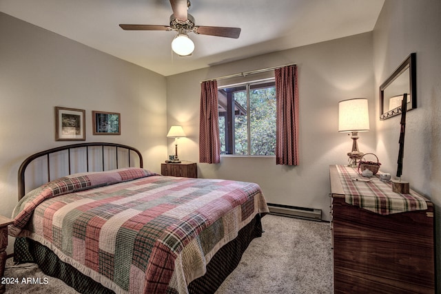 carpeted bedroom with a baseboard radiator and ceiling fan