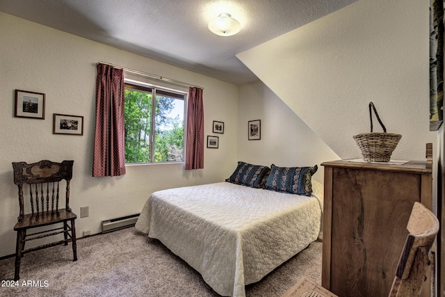 bedroom featuring vaulted ceiling, a textured ceiling, baseboard heating, and carpet flooring