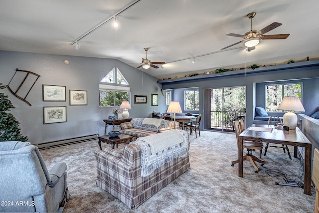 carpeted living room with a healthy amount of sunlight, ceiling fan, a baseboard heating unit, and rail lighting