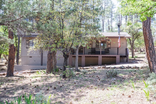 view of front of home featuring a wooden deck