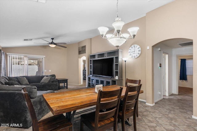 tiled dining room featuring ceiling fan and lofted ceiling